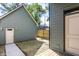The backyard features an external door leading to a small patch of lawn at 39 N Walcott St, Indianapolis, IN 46201
