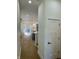 Bright entryway with hardwood floors leading to an open-concept kitchen and living area at 39 N Walcott St, Indianapolis, IN 46201