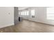 Open concept kitchen featuring grey cabinets, light hardwood floors and bright natural light at 39 N Walcott St, Indianapolis, IN 46201
