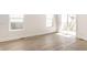 Bright living room featuring hardwood floors and a sliding glass door at 39 N Walcott St, Indianapolis, IN 46201