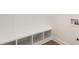 Mudroom featuring a built in bench with cubbies and access to hookups at 39 N Walcott St, Indianapolis, IN 46201