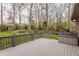 Outdoor deck with view of fenced backyard and mature trees, ideal for relaxing and entertaining at 4037 Oakleaf Dr, Zionsville, IN 46077
