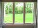 Window view to the backyard with luscious green grass at 4037 Oakleaf Dr, Zionsville, IN 46077