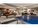 Finished basement with a pool table, ping pong, and bar with seating at 4037 Oakleaf Dr, Zionsville, IN 46077