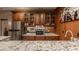 Finished basement bar with stainless steel refrigerator, cabinets, and granite counters at 4037 Oakleaf Dr, Zionsville, IN 46077