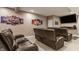 Finished basement theater with leather reclining chairs and a large screen tv at 4037 Oakleaf Dr, Zionsville, IN 46077