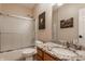 Bathroom featuring a shower-tub combination with sliding glass door and granite countertop at 4037 Oakleaf Dr, Zionsville, IN 46077
