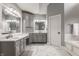 Primary bathroom with dual vanity, tub, and lots of counter space at 4037 Oakleaf Dr, Zionsville, IN 46077