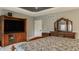 Cozy bedroom featuring a tv, a dresser with mirror, and a plush bed at 4037 Oakleaf Dr, Zionsville, IN 46077