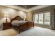 Relaxing bedroom showcasing a wood-framed bed, side tables, and a bright window view at 4037 Oakleaf Dr, Zionsville, IN 46077