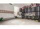 Spacious garage featuring ample storage solutions, including cabinets and tool organizers at 4037 Oakleaf Dr, Zionsville, IN 46077