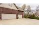 Spacious two-car garage with a concrete driveway and well-maintained landscaping at 4037 Oakleaf Dr, Zionsville, IN 46077