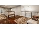A spacious upstairs landing connects different areas of the home, featuring wood floors and decorative railings at 4037 Oakleaf Dr, Zionsville, IN 46077
