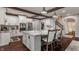 Open kitchen with granite counters, stainless appliances, a large island, and hardwood floors at 4037 Oakleaf Dr, Zionsville, IN 46077