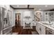 Bright kitchen features a built-in desk area, stainless steel appliances, and hardwood floors at 4037 Oakleaf Dr, Zionsville, IN 46077