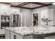 Open kitchen with granite countertops, white cabinetry, and stainless steel appliances at 4037 Oakleaf Dr, Zionsville, IN 46077