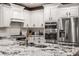 Updated kitchen boasts stainless steel appliances, and a large island with granite counters at 4037 Oakleaf Dr, Zionsville, IN 46077
