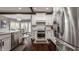 Well-equipped kitchen featuring stainless steel appliances, granite countertops, and white cabinetry at 4037 Oakleaf Dr, Zionsville, IN 46077