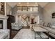 Bright living room showcases high ceilings, a staircase, and comfortable furniture at 4037 Oakleaf Dr, Zionsville, IN 46077