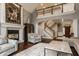 Grand living room featuring a fireplace, staircase, and ample seating at 4037 Oakleaf Dr, Zionsville, IN 46077