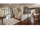 Open-concept living room with abundant natural light and beautiful staircase at 4037 Oakleaf Dr, Zionsville, IN 46077