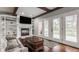 Cozy living room features a fireplace, built-in shelving, and hardwood floors at 4037 Oakleaf Dr, Zionsville, IN 46077