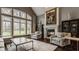 Comfortable living room features a fireplace and large windows, perfect for relaxation at 4037 Oakleaf Dr, Zionsville, IN 46077