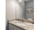 Clean powder room featuring a granite countertop, under-mount sink, and modern faucet at 4037 Oakleaf Dr, Zionsville, IN 46077
