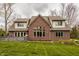 Elegant brick home with a spacious deck and well-manicured lawn at 4037 Oakleaf Dr, Zionsville, IN 46077