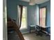Stylish bedroom featuring a loft bed and a modern desk area with natural lighting at 404 Pearl St, Pendleton, IN 46064