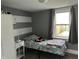 Comfortable bedroom with a metal bed frame and a side table with ample lighting at 404 Pearl St, Pendleton, IN 46064