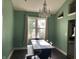 Elegant dining room with modern lighting, a large window, and seating for six at 404 Pearl St, Pendleton, IN 46064