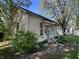 Side view of a cozy home featuring well-maintained landscaping and a charming entrance at 404 Pearl St, Pendleton, IN 46064