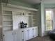 Bright living room featuring custom built-ins, providing ample storage and display space at 404 Pearl St, Pendleton, IN 46064