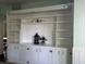 Bright living room featuring custom built-ins with ample storage and display space at 404 Pearl St, Pendleton, IN 46064