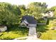 Aerial view of a well maintained home with lush landscaping and a driveway at 410 Wood Hollow Ct, Westfield, IN 46074