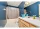 Well-lit bathroom with a combination shower and tub, ample counter space, and neutral walls at 410 Wood Hollow Ct, Westfield, IN 46074