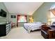 Spacious bedroom with a checkered blanket and a bay window bringing in natural light at 410 Wood Hollow Ct, Westfield, IN 46074