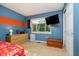 Cozy bedroom with natural light, closet, and neutral tones with a flatscreen TV at 410 Wood Hollow Ct, Westfield, IN 46074