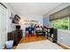 Well-lit bedroom featuring a large window, playful decor, and ample floor space at 410 Wood Hollow Ct, Westfield, IN 46074