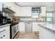 Bright kitchen with white cabinets, stainless steel appliances, and granite countertops at 410 Wood Hollow Ct, Westfield, IN 46074