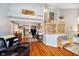 Open-concept living space with hardwood floors, a staircase, comfortable seating, and lofted area at 410 Wood Hollow Ct, Westfield, IN 46074