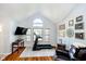 Bright room with a treadmill, hardwood floors, a vaulted ceiling and plenty of natural light from large windows at 410 Wood Hollow Ct, Westfield, IN 46074