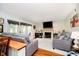 Inviting living room with a fireplace, french doors, hardwood floors, comfortable sofas and natural light at 410 Wood Hollow Ct, Westfield, IN 46074