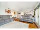 Bright living room with hardwood floors, neutral paint, comfortable sofas and easy access to the kitchen at 410 Wood Hollow Ct, Westfield, IN 46074