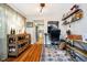 Comfortable office space with hardwood floors, a bar cart, shelving, and access to the kitchen at 410 Wood Hollow Ct, Westfield, IN 46074