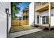 This backyard features a combination of new grass and concrete with a charming wood fence at 43 N Walcott St, Indianapolis, IN 46201