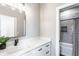 Bathroom featuring double vanity, white countertops, and access to a shower-tub combo at 43 N Walcott St, Indianapolis, IN 46201