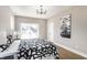 Comfortable bedroom with walkout patio and view of the neighborhood at 43 N Walcott St, Indianapolis, IN 46201