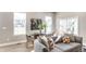 Bright dining area with modern decor, a glass table, and large windows for ample natural light at 43 N Walcott St, Indianapolis, IN 46201
